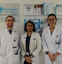 Program director posing with two fellows